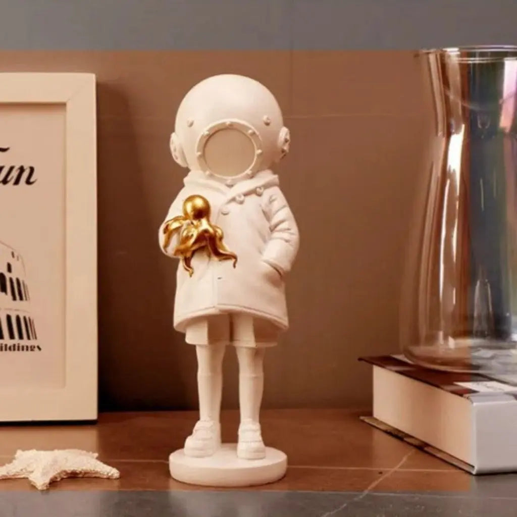 Cosmic Explorer Figurine with Golden Sea Creature