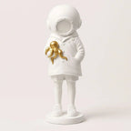 Cosmic Explorer Figurine with Golden Sea Creature