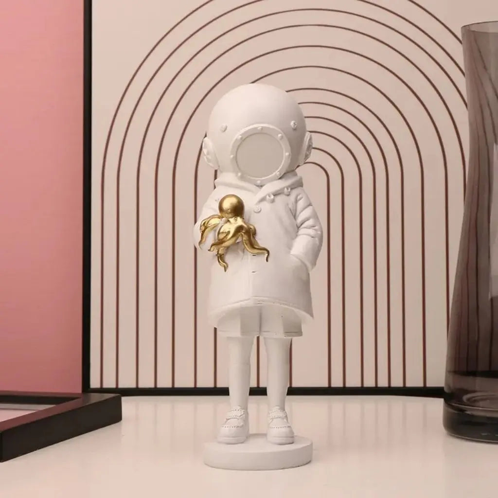 Cosmic Explorer Figurine with Golden Sea Creature