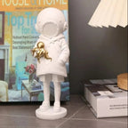 Cosmic Explorer Figurine with Golden Sea Creature
