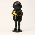 Cosmic Explorer Figurine with Golden Sea Creature