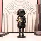 Cosmic Explorer Figurine with Golden Sea Creature