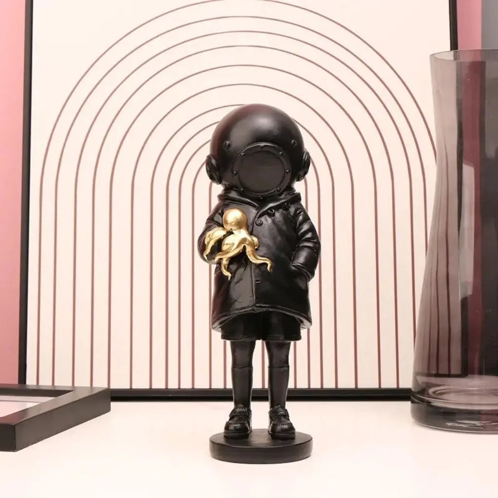 Cosmic Explorer Figurine with Golden Sea Creature