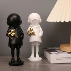Cosmic Explorer Figurine with Golden Sea Creature