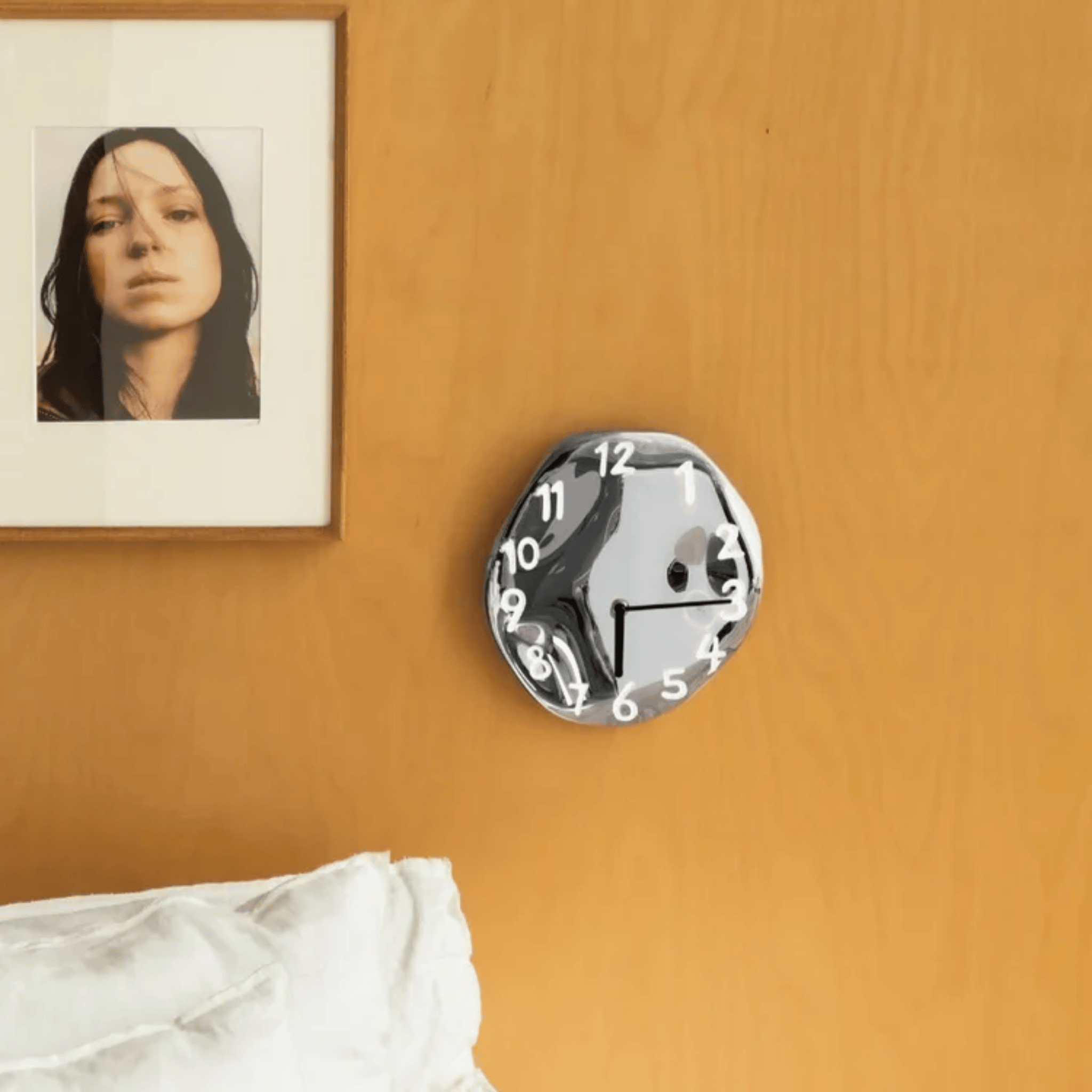 Sleek Ceramic Wall Timepiece with Chrome Accents