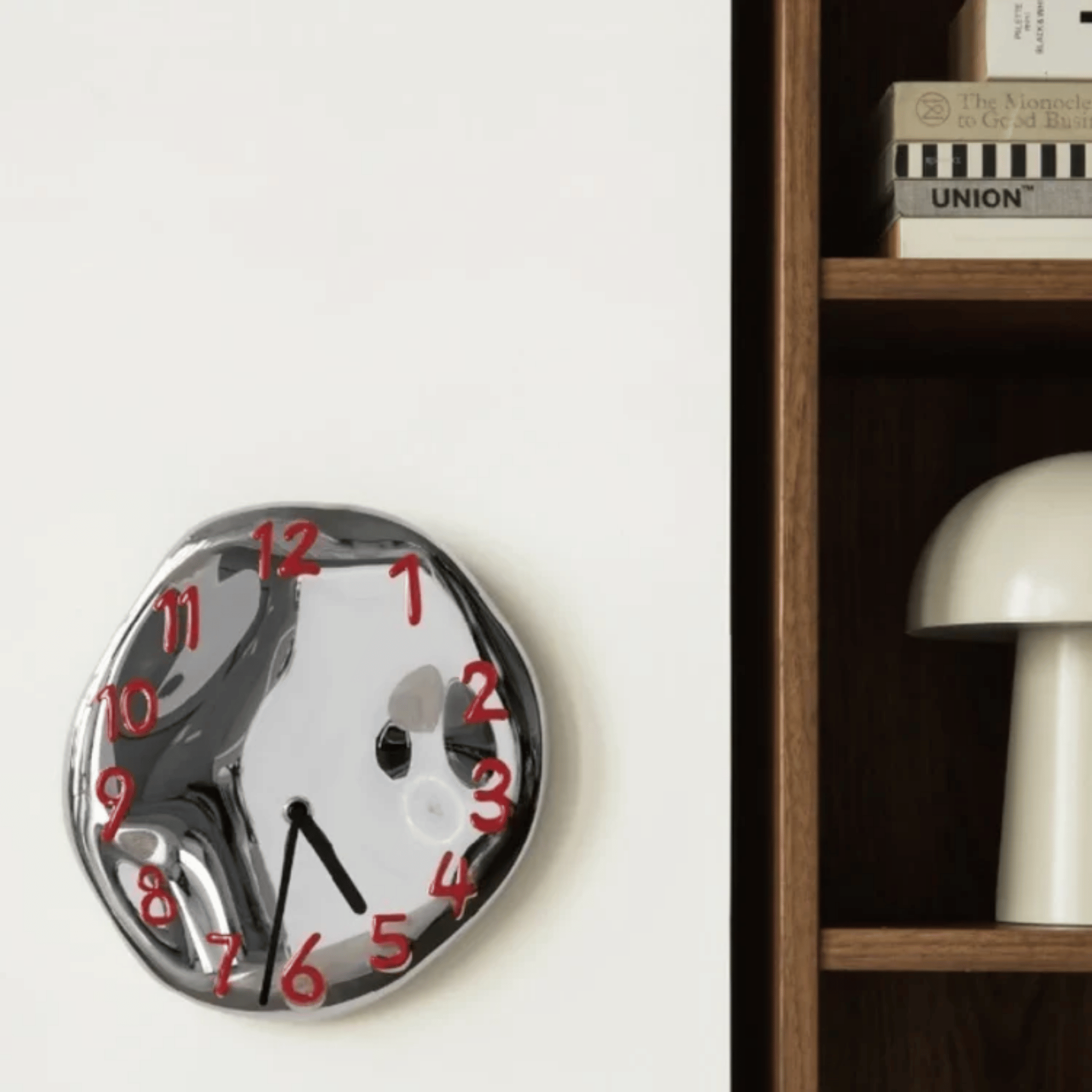Sleek Ceramic Wall Timepiece with Chrome Accents