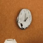 Sleek Ceramic Wall Timepiece with Chrome Accents