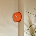 Chic Orange Corner Wall Clock for Modern Homes