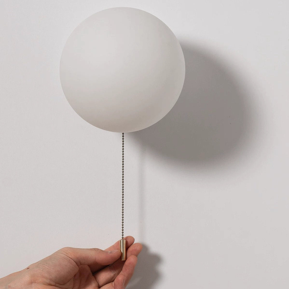 Luminous Glass Globe Wall Light for Modern Spaces