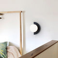 Hand-Finished Glass Globe & Minimalist Iron Frame Wall Sconce