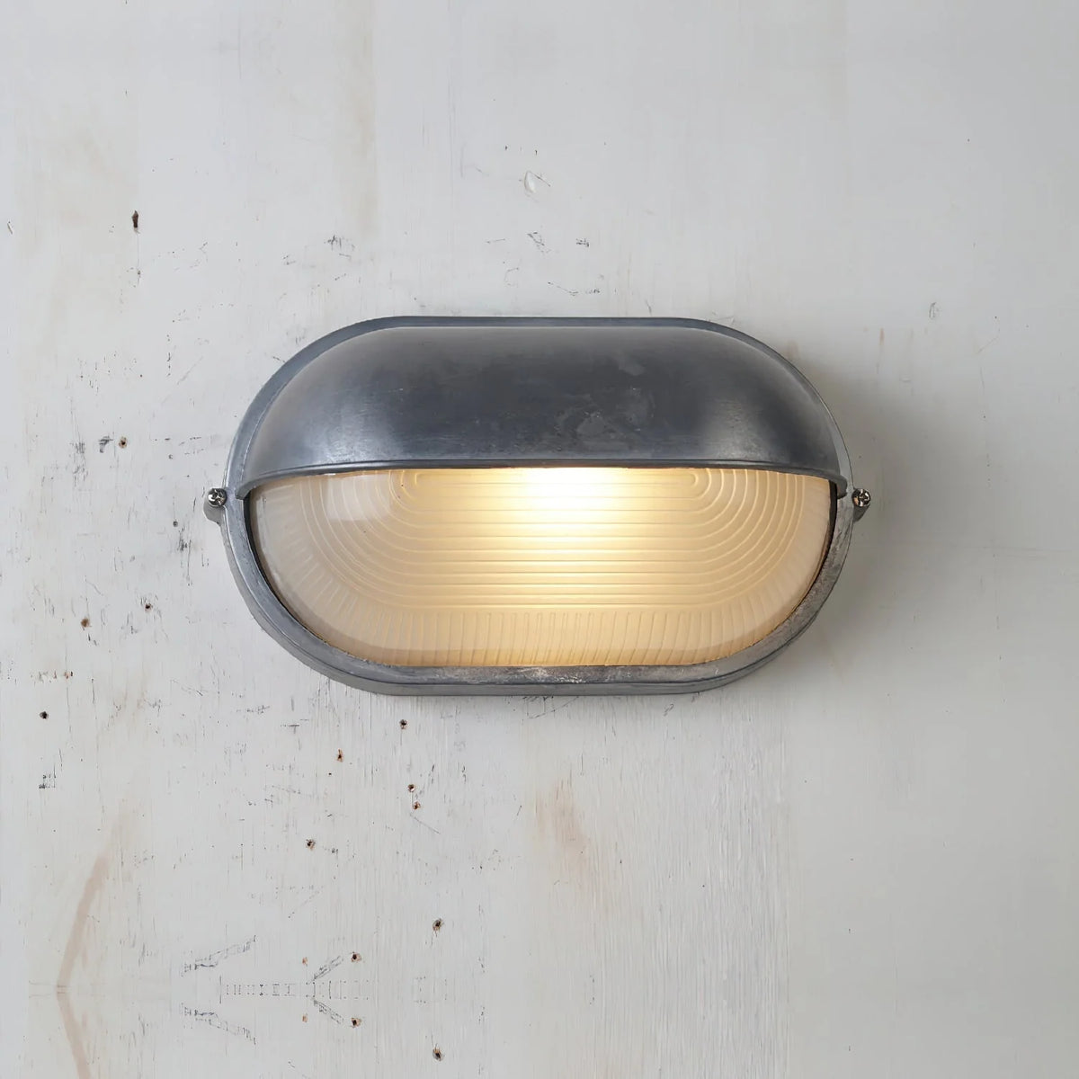Oval Bulkhead Wall Light Weather-Resistant Galvanized Metal & Ribbed Glass