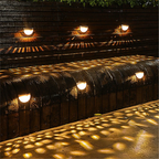 Round Black Solar Wall Light for Outdoor Use with Decorative Pattern