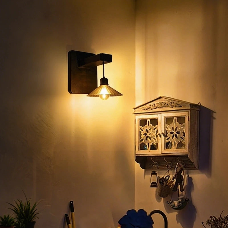 Wall Mounted Outdoor Light Featuring Hanging Shade and Dusk Sensor