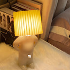 Table Lamp with Pleated Shade in Human Figure Design