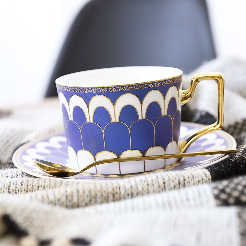 Decorative Tea Cup Set featuring Gold Handles and Matching Saucers