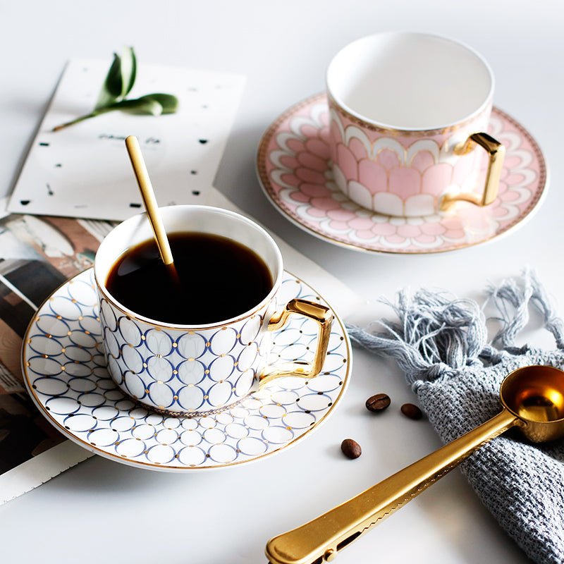 Decorative Tea Cup Set featuring Gold Handles and Matching Saucers