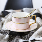 Decorative Tea Cup Set featuring Gold Handles and Matching Saucers