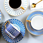Decorative Tea Cup Set featuring Gold Handles and Matching Saucers