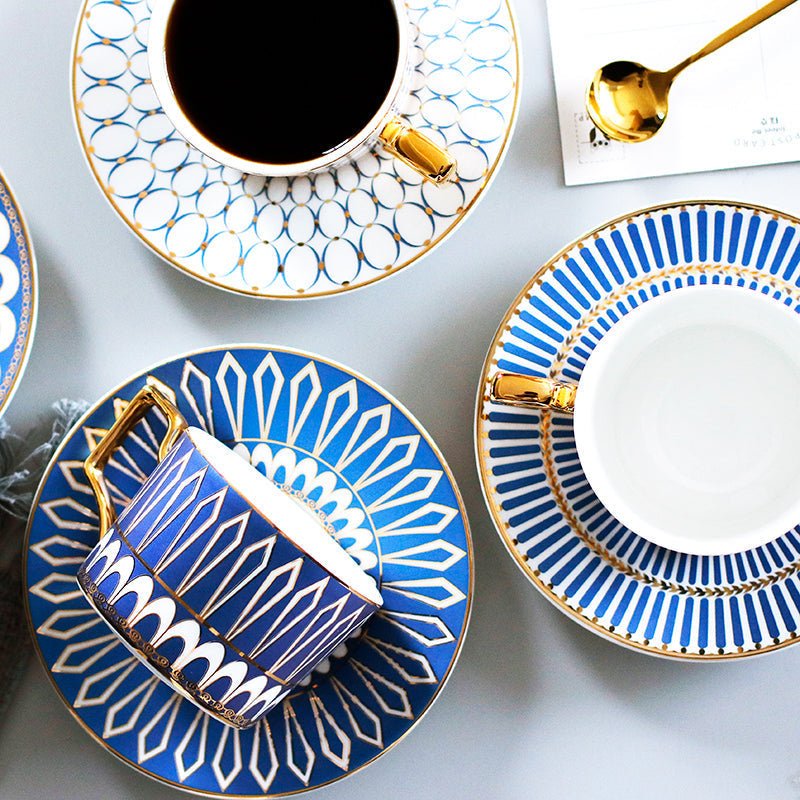Decorative Tea Cup Set featuring Gold Handles and Matching Saucers
