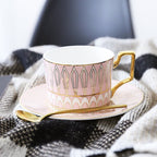Decorative Tea Cup Set featuring Gold Handles and Matching Saucers