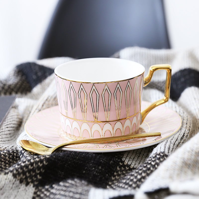 Decorative Tea Cup Set featuring Gold Handles and Matching Saucers