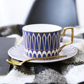 Decorative Tea Cup Set featuring Gold Handles and Matching Saucers