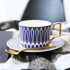 Decorative Tea Cup Set featuring Gold Handles and Matching Saucers