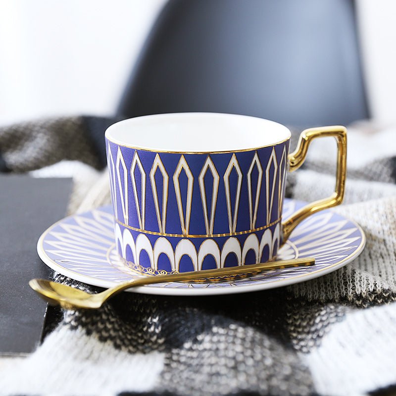 Decorative Tea Cup Set featuring Gold Handles and Matching Saucers