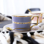 Decorative Tea Cup Set featuring Gold Handles and Matching Saucers
