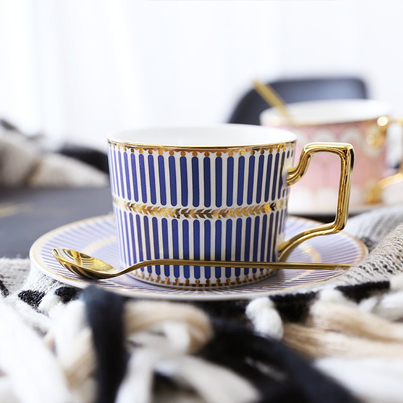 Decorative Tea Cup Set featuring Gold Handles and Matching Saucers