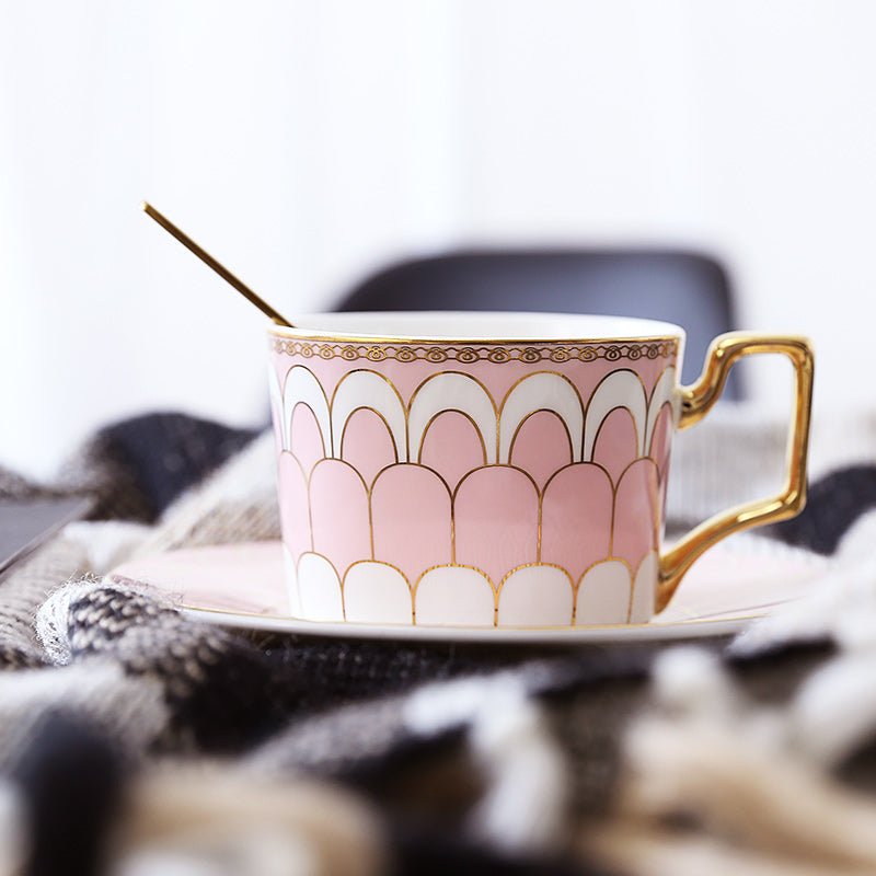 Decorative Tea Cup Set featuring Gold Handles and Matching Saucers