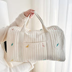 Embroidered Design Travel Bag with Quilted Texture