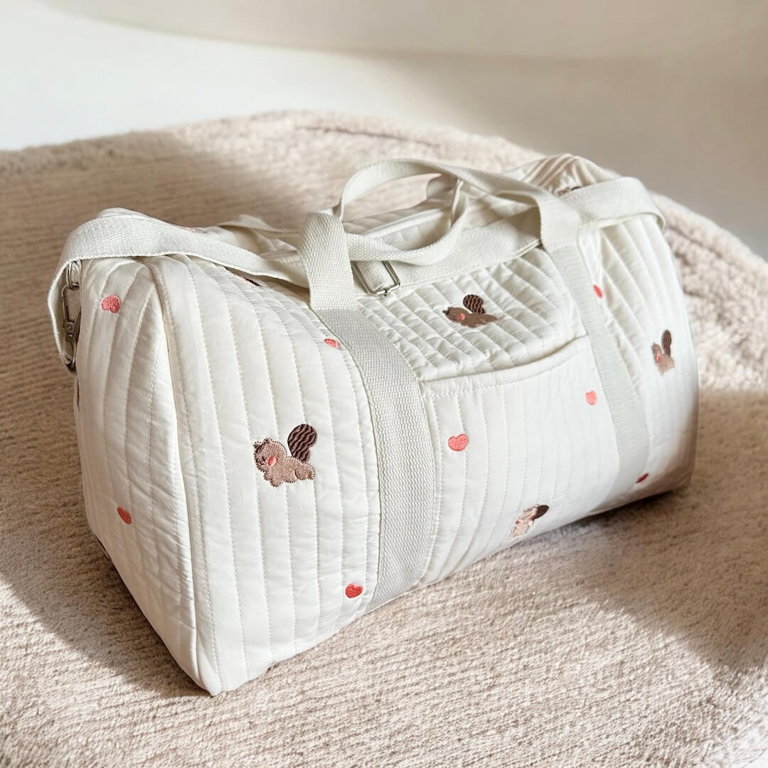 Embroidered Design Travel Bag with Quilted Texture